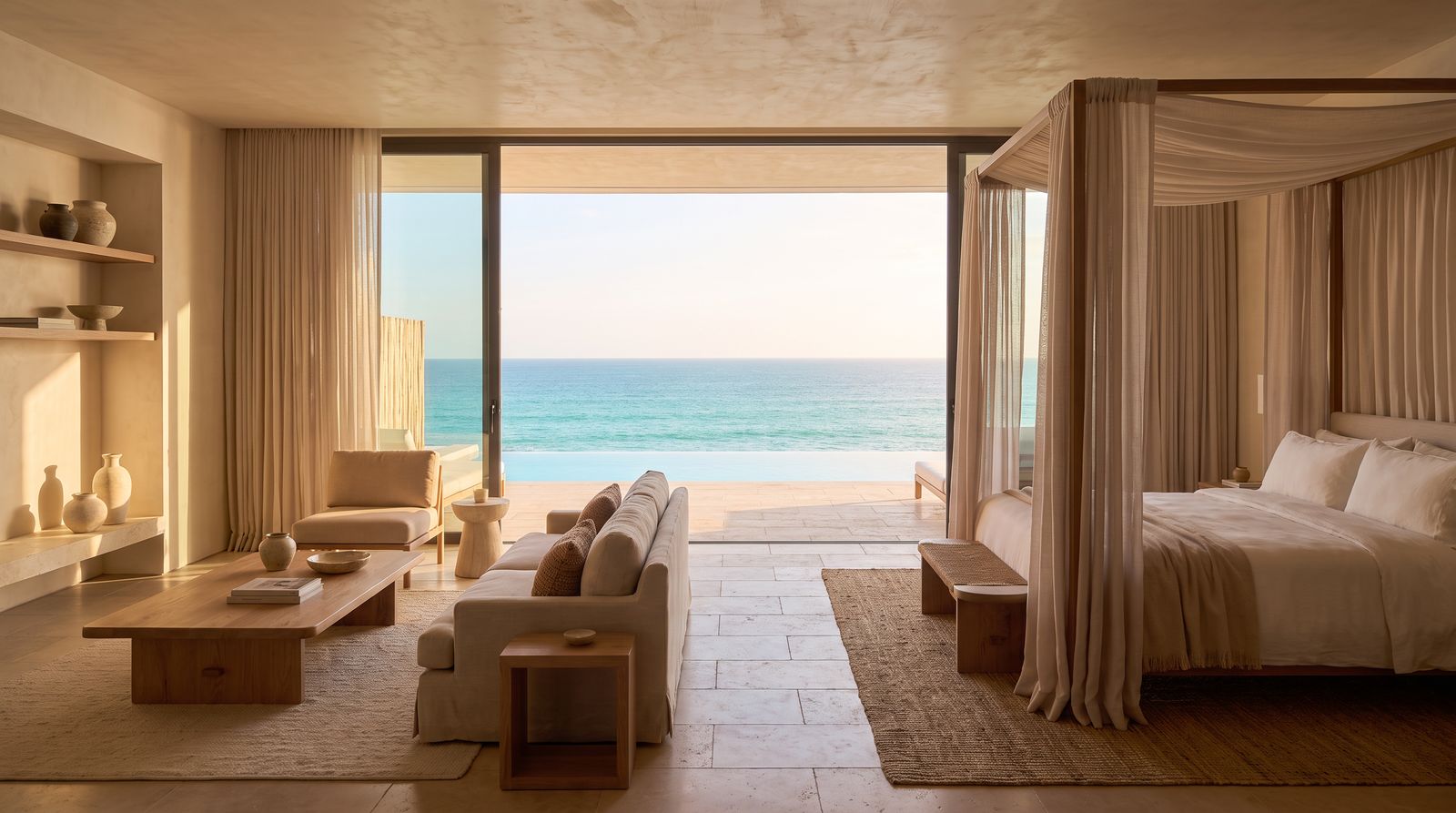 Ocean-view luxury bedroom suite interior at golden hour